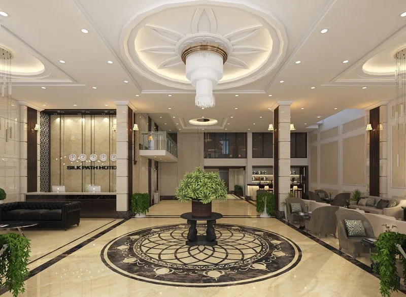 Sảnh khách sạn mang phong cách hiện đại có đường nét đơn giản, phóng khoáng, phối hợp cây xanh tạo cảm giác mới mẻ